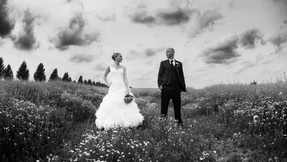 Wedding couple in a field near Rostock in black-and-white
