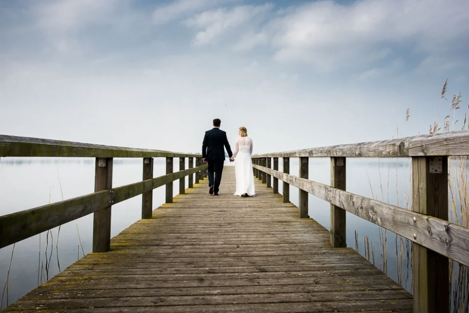 Wedding couple on a jetty