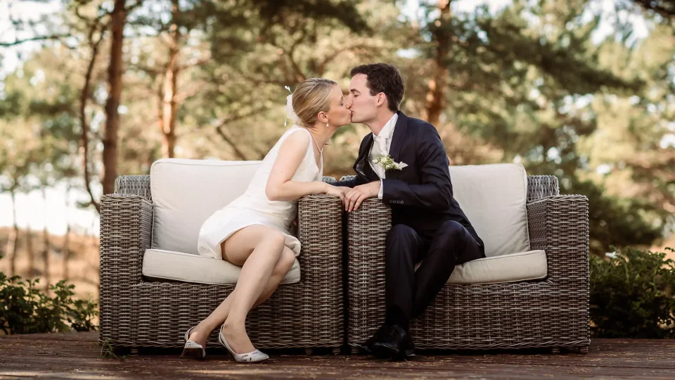 Bride and groom kiss at a wedding in Dierhagen